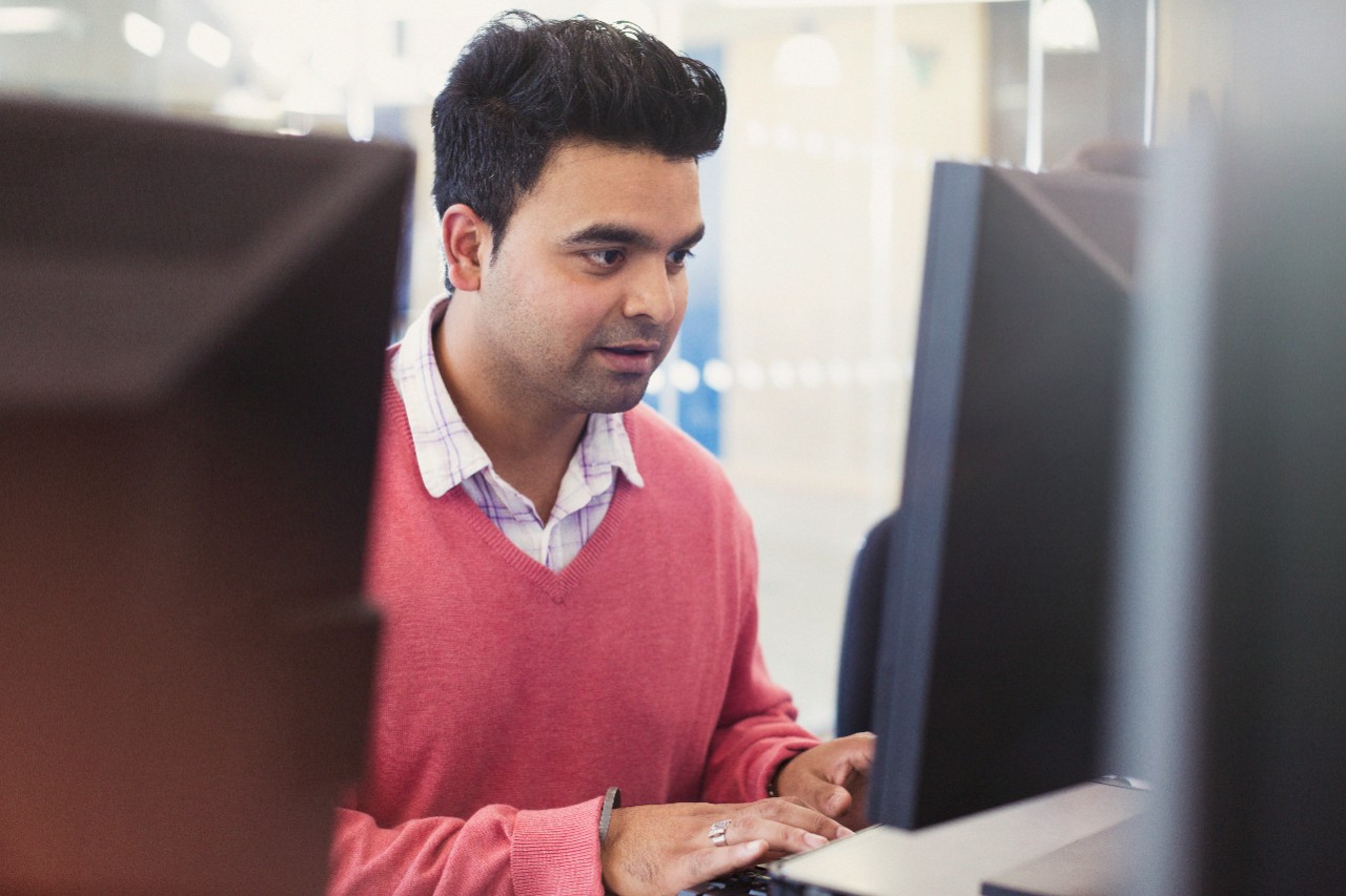 Man at computer in classroom