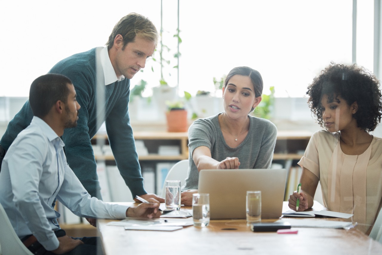 Group of business colleagues meeting in the boardroom