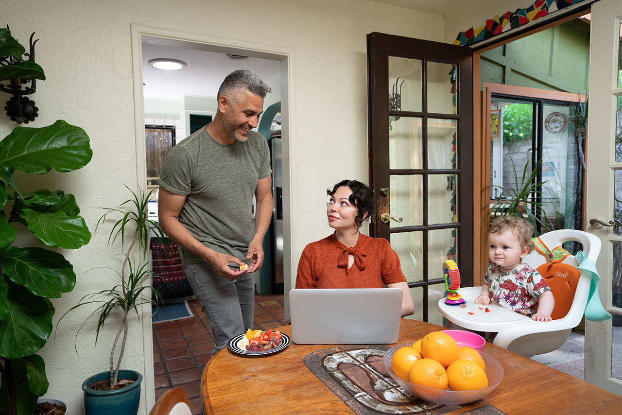 Family at home, wife on laptop