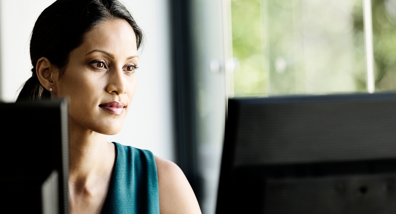 Businesswoman working on computer in office