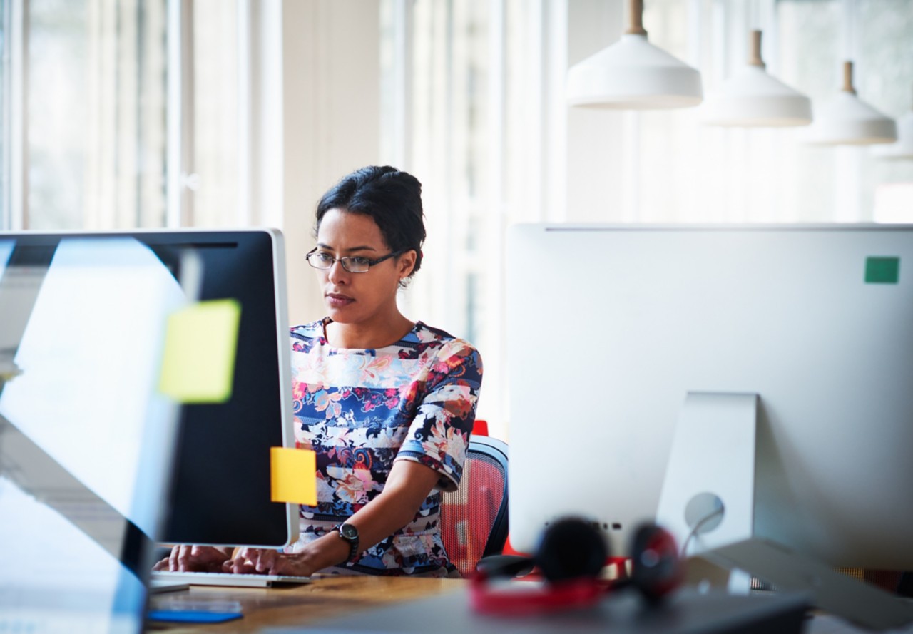 Woman working at office on computer